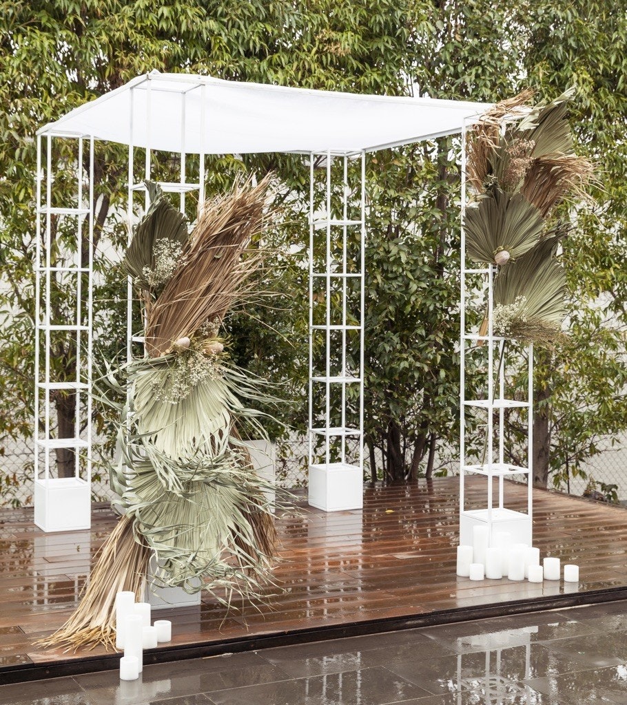Wedding ceremony archway with floral installation.